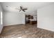 Open concept living space showcasing hardwood floors and a seamless flow into the kitchen area at 1414 Excelsior Grand Ave, Durham, NC 27713