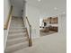 View of staircase and kitchen with stainless steel appliances and island at 1414 Excelsior Grand Ave, Durham, NC 27713