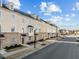 Charming townhomes with brick accents, manicured lawns, and tree-lined streets at 1414 Excelsior Grand Ave, Durham, NC 27713