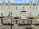 Well-maintained townhome with brick accents, bay windows, and welcoming front entrances at 1414 Excelsior Grand Ave, Durham, NC 27713