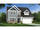 Charming two-story home featuring a stone foundation, stylish siding, a two-car garage, and a well-manicured lawn at 143 Sugar Pine Drive, Franklinton, NC 27525