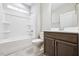 Bathroom with a tub, updated fixtures, and vanity with cabinetry at 1987 Meadowview Dr, Graham, NC 27253