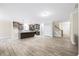 Bright, open-concept living room and kitchen space with hardwood floors, neutral paint and lots of natural light at 1987 Meadowview Dr, Graham, NC 27253