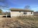 Exterior view of the home showcasing the backyard and building architecture at 207 Lawrence St, Fuquay Varina, NC 27526