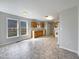 Open kitchen with ample counter space, white appliances, and durable tile flooring at 207 Lawrence St, Fuquay Varina, NC 27526
