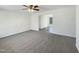 Spacious living room with modern ceiling fan, and soft carpet at 207 Lawrence St, Fuquay Varina, NC 27526