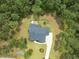 Aerial view of a stunning home with a lush, landscaped yard and outdoor play area at 240 Seaforth Landing Dr, Pittsboro, NC 27312