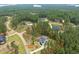 Aerial view of property at 240 Seaforth Landing, nestled among trees at 240 Seaforth Landing Dr, Pittsboro, NC 27312