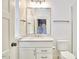 Bright bathroom featuring a vanity, framed mirror, and adjacent toilet and walk-in shower at 240 Seaforth Landing Dr, Pittsboro, NC 27312