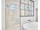 Luxurious bathroom featuring a glass-enclosed shower and a freestanding soaking tub at 240 Seaforth Landing Dr, Pittsboro, NC 27312