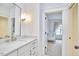 Well-lit bathroom featuring a vanity, marble countertop, and doorway to Bedroom at 240 Seaforth Landing Dr, Pittsboro, NC 27312
