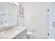 Bright bathroom featuring a vanity with white countertop, glass shower, and modern fixtures at 240 Seaforth Landing Dr, Pittsboro, NC 27312