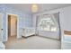 Charming Bedroom with wave wallpaper, neutral carpet, and a window with neighborhood view at 240 Seaforth Landing Dr, Pittsboro, NC 27312