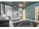 Fun bedroom featuring a bed with house frame, dark green walls and a window at 240 Seaforth Landing Dr, Pittsboro, NC 27312