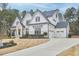 Beautiful two-story home with manicured lawn and three car garage at 240 Seaforth Landing Dr, Pittsboro, NC 27312