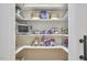 A walk-in pantry with well-organized shelving, providing ample storage for groceries and kitchen essentials at 240 Seaforth Landing Dr, Pittsboro, NC 27312