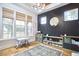 Well-lit play room with hardwood floors, a large window, a black accent wall, and ample toy storage at 240 Seaforth Landing Dr, Pittsboro, NC 27312