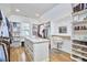 Spacious walk-in closet with custom shelving, island and plenty of storage space at 240 Seaforth Landing Dr, Pittsboro, NC 27312