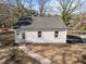 Rear aerial view of a home showcasing new roof, siding, and refreshed landscaping at 2504 E East Geer St, Durham, NC 27704