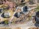 An aerial view showing the house, outbuilding, long driveway, landscaping, and neighborhood at 2504 E East Geer St, Durham, NC 27704