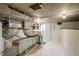 An unfinished basement featuring exposed ductwork and white painted walls at 2504 E East Geer St, Durham, NC 27704