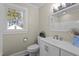 A well-lit bathroom with neutral colors featuring a modern vanity and natural light at 2504 E East Geer St, Durham, NC 27704