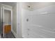 The bathroom showcases a clean, white shower-tub combination that offers a relaxing and functional space at 2504 E East Geer St, Durham, NC 27704