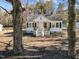 Charming home with front porch, updated concrete stairs, and black shutters at 2504 E East Geer St, Durham, NC 27704