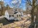 Charming home with a inviting porch, updated concrete stairs, and black shutters at 2504 E East Geer St, Durham, NC 27704
