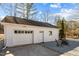 Detached garage with gravel, double doors and comfortable outdoor seating at 2504 E East Geer St, Durham, NC 27704