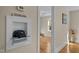 Hallway featuring a built-in display shelf with a unique vintage telephone, creating a charming focal point at 2504 E East Geer St, Durham, NC 27704