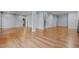 Spacious finished basement with wood-look flooring and access to other rooms at 2600 Buckingham Dr, Sanford, NC 27330