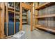 Unfinished basement storage area with wooden shelving and concrete flooring at 2600 Buckingham Dr, Sanford, NC 27330