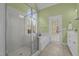 Bathroom featuring a glass shower and separate soaking tub at 2600 Buckingham Dr, Sanford, NC 27330