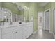Bathroom with double vanity, neutral finishes and tile floor at 2600 Buckingham Dr, Sanford, NC 27330