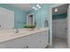 Bathroom with double sink vanity, large mirror, and access to the shower at 2600 Buckingham Dr, Sanford, NC 27330