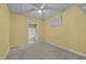 Carpeted bedroom with ensuite bathroom access and decorative painting at 2600 Buckingham Dr, Sanford, NC 27330