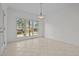 Bright dining room with large window and tiled floors at 2600 Buckingham Dr, Sanford, NC 27330