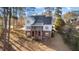 Charming two-story home featuring a brick foundation and upper deck nestled among mature trees at 2600 Buckingham Dr, Sanford, NC 27330