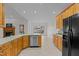 Open-concept kitchen with stainless steel appliances and a view to the dining area at 2600 Buckingham Dr, Sanford, NC 27330
