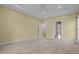 Bright main bedroom with tray ceiling and ensuite bath at 2600 Buckingham Dr, Sanford, NC 27330