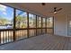 Screened-in porch with wood floors and scenic views of the backyard at 2600 Buckingham Dr, Sanford, NC 27330