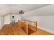 Spacious attic with hardwood floors and a rustic railing at 2609 Pleasant Hill Liberty Rd, Liberty, NC 27298