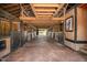 Rustic barn interior with horse stalls and a view of the surrounding landscape at 2609 Pleasant Hill Liberty Rd, Liberty, NC 27298