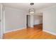 Spacious room featuring hardwood floors and neutral paint, providing a blank canvas at 2609 Pleasant Hill Liberty Rd, Liberty, NC 27298