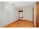 Bedroom with hardwood floors, wood paneling, and a window for natural light at 2609 Pleasant Hill Liberty Rd, Liberty, NC 27298