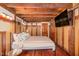 Comfortable bedroom featuring exposed wood beams, accents, and a flat screen tv at 2609 Pleasant Hill Liberty Rd, Liberty, NC 27298