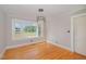 Bright bedroom with hardwood floors, large windows offering a view of the countryside at 2609 Pleasant Hill Liberty Rd, Liberty, NC 27298