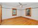Cozy bedroom featuring wood floors, neutral paint and two windows providing ample light at 2609 Pleasant Hill Liberty Rd, Liberty, NC 27298