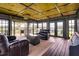 Comfortable enclosed porch with ample seating and views of the outdoors at 2609 Pleasant Hill Liberty Rd, Liberty, NC 27298